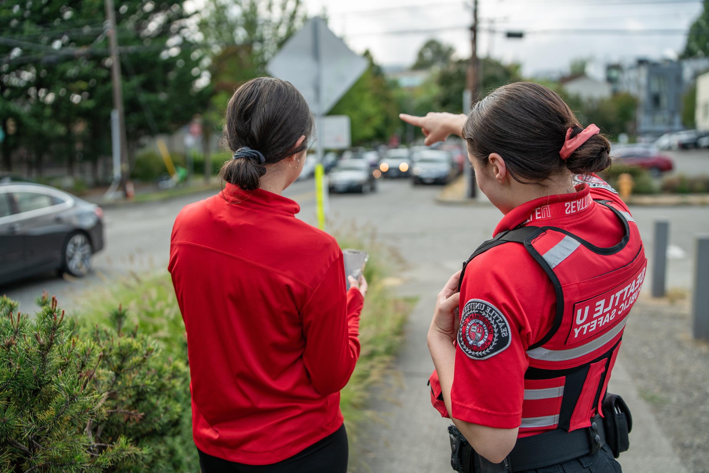 DPS officer giving directions to a student